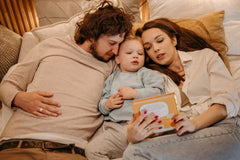 family is reading before going sleep