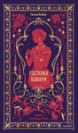 Обложка книги «Госпожа Бовари» с женским силуэтом, свечами и цветочным орнаментом